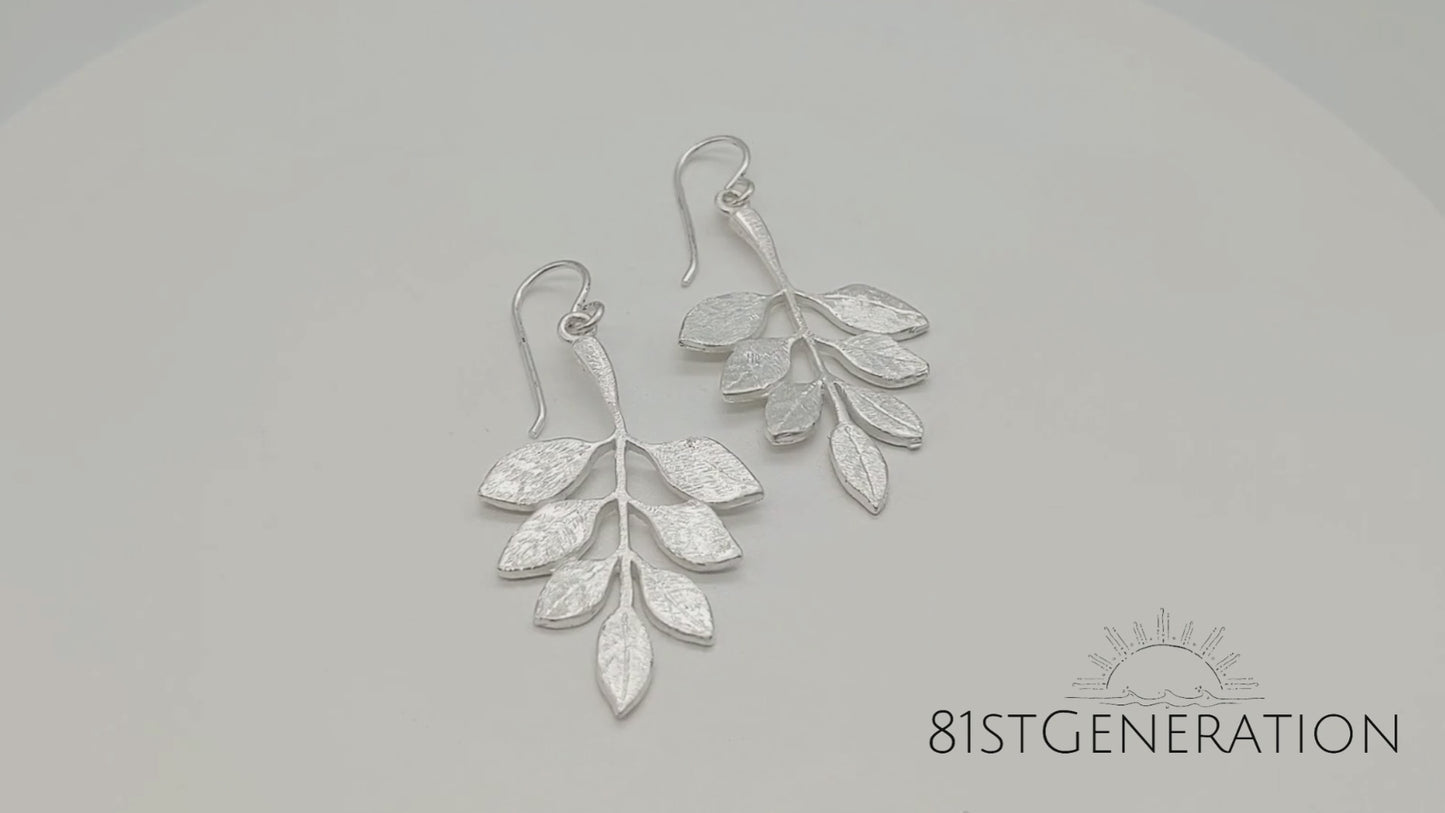 
                  
                    Load and play video in Gallery viewer, Sterling Silver Satin Finish Twig Plant Textured Leaf Dangle Earrings
                  
                