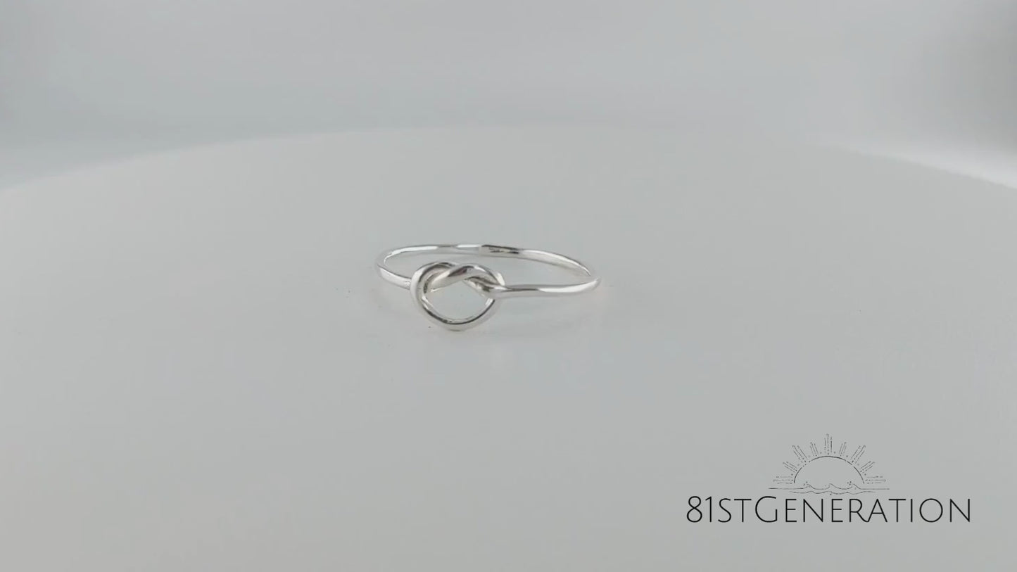 
                  
                    Load and play video in Gallery viewer, Sterling Silver Simply Love Knot Thin Tube Wire Stackable Ring
                  
                