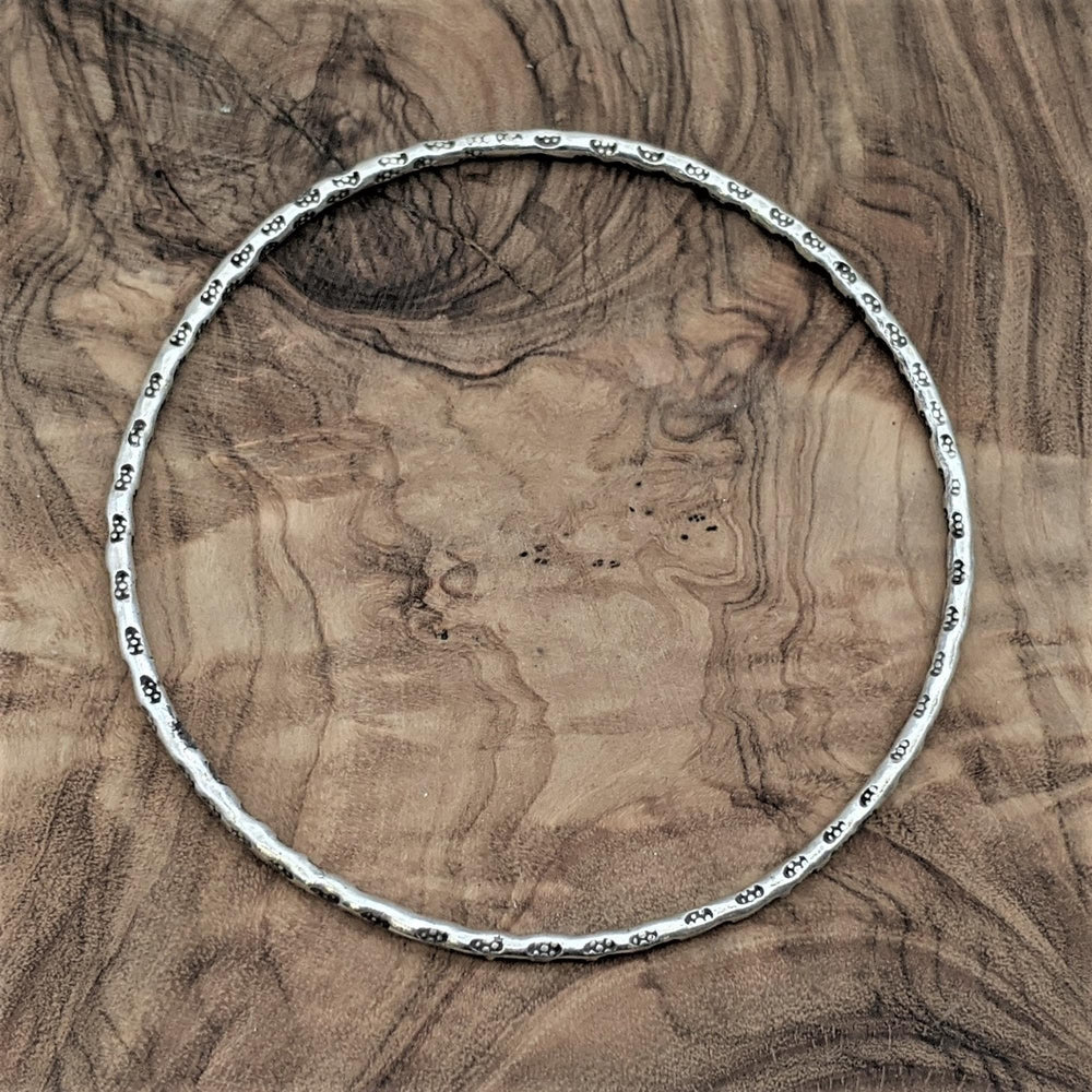
                  
                    Pure Silver Hill Tribe Thin Round Tribal Motif Stackable Bangle
                  
                