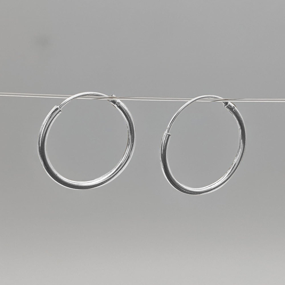 
                  
                    Sterling Silver 1.2 mm 16 mm Thin Hoops Sleeper Hoop Earrings
                  
                
