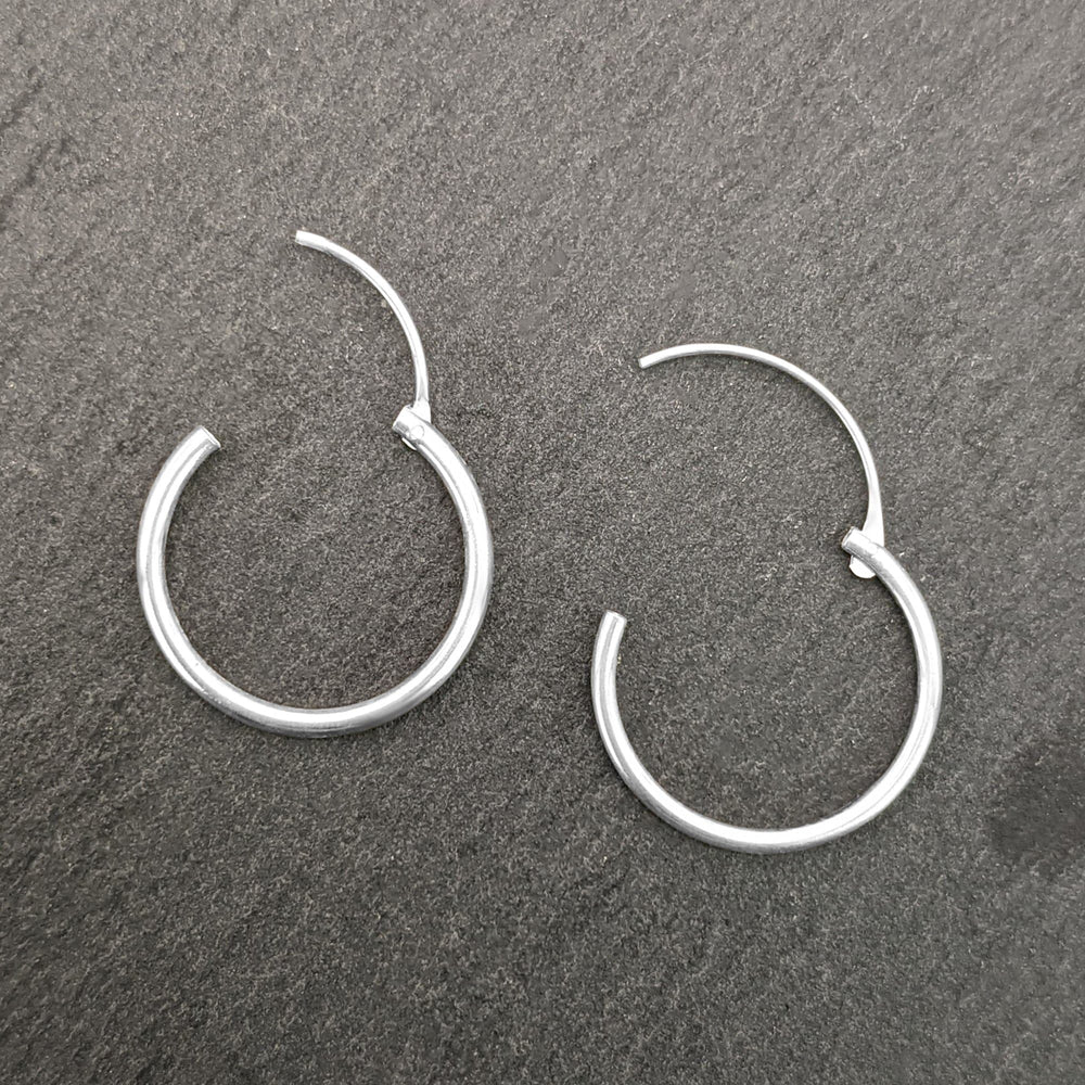 
                  
                    Sterling Silver 1.2 mm 16 mm Thin Hoops Sleeper Hoop Earrings
                  
                