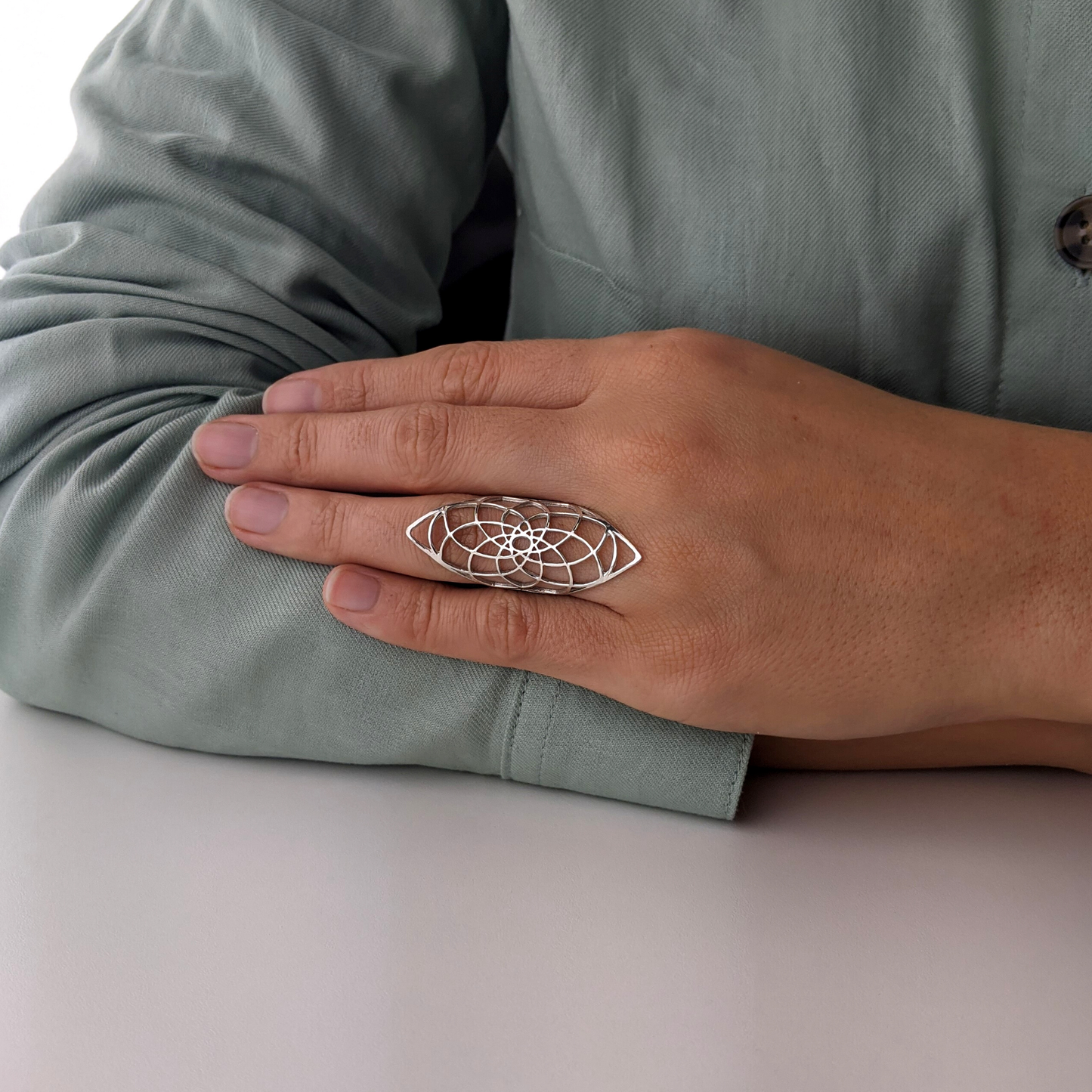 
                  
                    Sterling Silver Wide Cut-Out Flower of Life Armour Half-Finger Ring
                  
                