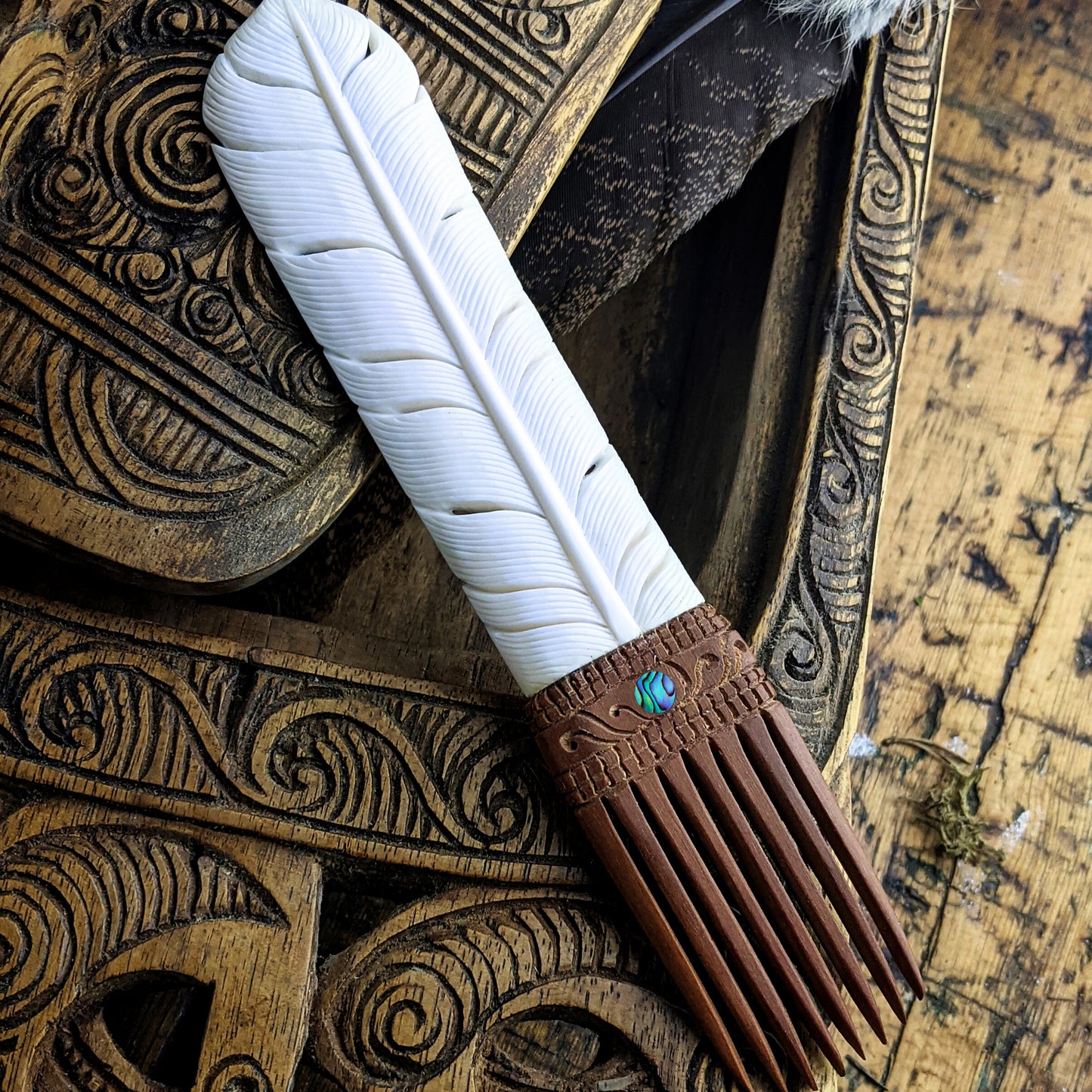 
                  
                    Bone Wood Abalone Shell Maori Style Tribal Huia Feather Hair Comb
                  
                