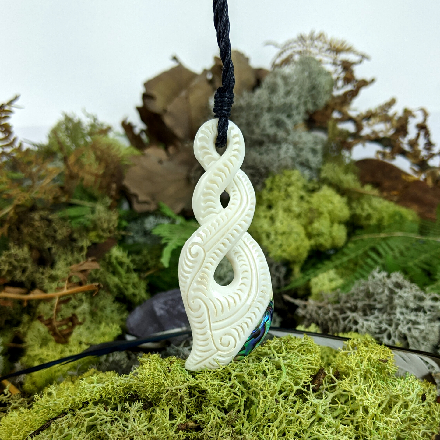 
                  
                    Bone Abalone Maori Style Triple Twist Pikorua Pendant Cord Necklace
                  
                