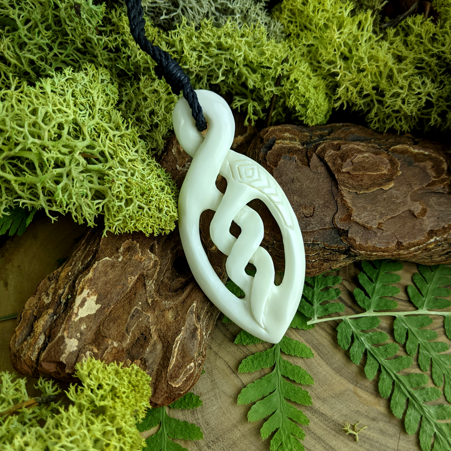 
                  
                    Bone Engraved Celtic Maori Style Triple Pikorua Pendant Cord Necklace
                  
                