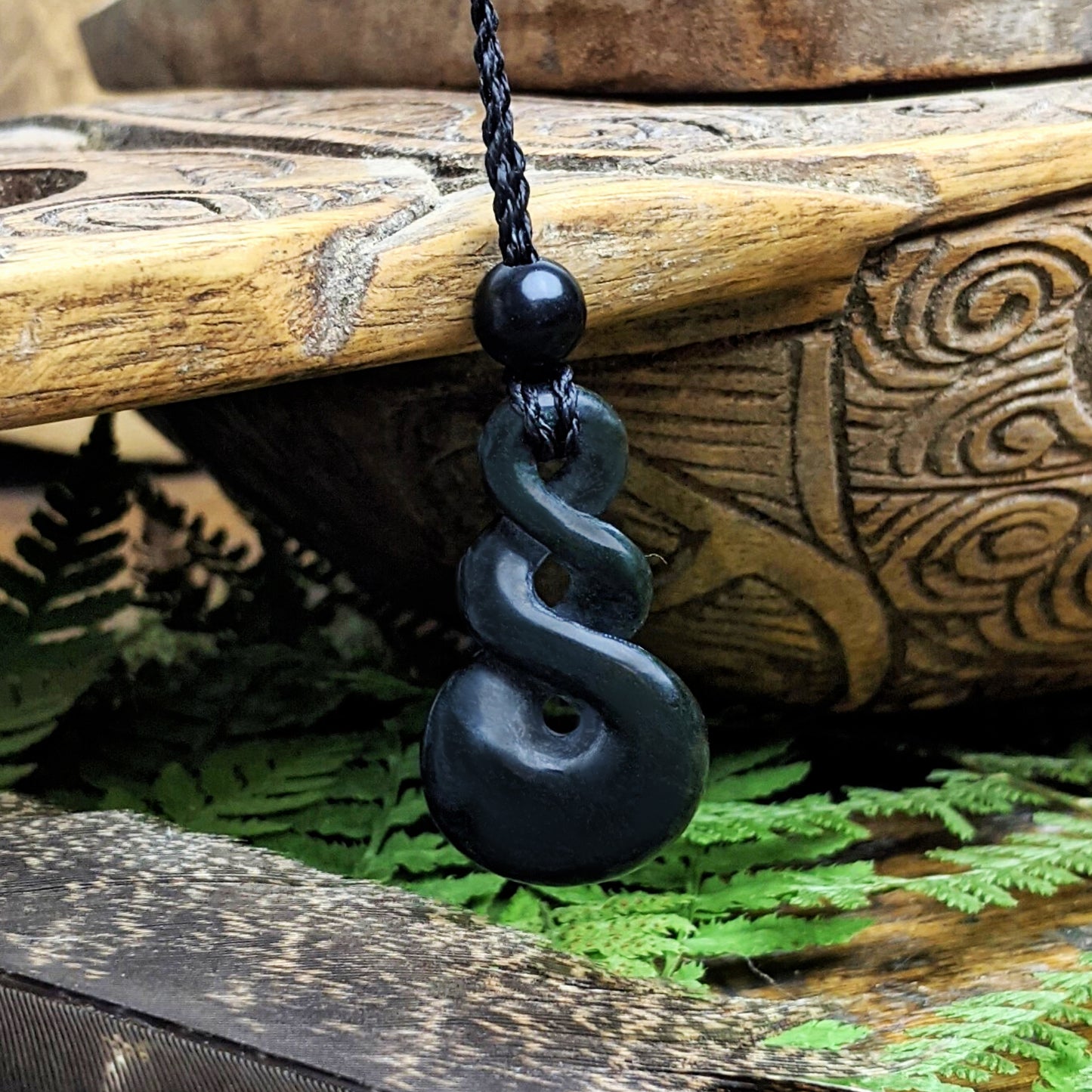 
                  
                    Dark Nephrite Jade Small Double Twist Pikorua Pendant Cord Necklace
                  
                