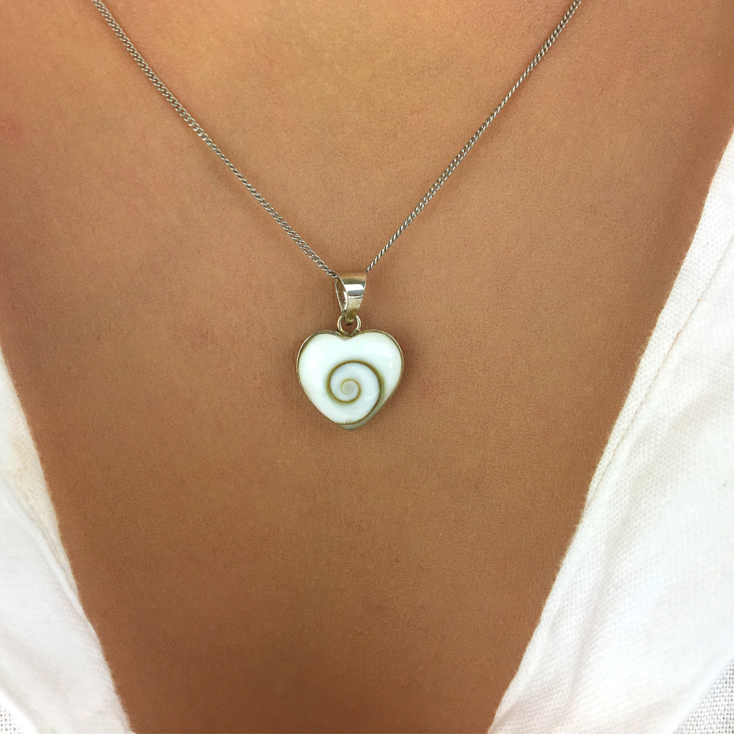 
                  
                    Sterling Silver Small Heart Shaped Shiva Eye Shell Pendant Necklace
                  
                
