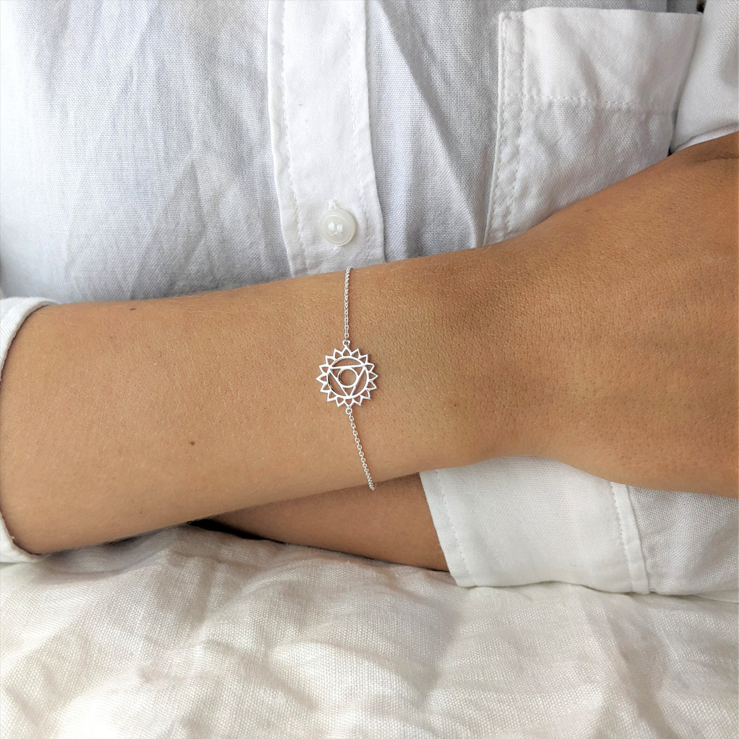 
                  
                    Sterling Silver Cut-Out Throat Chakra Thin Cable Chain Bracelet
                  
                