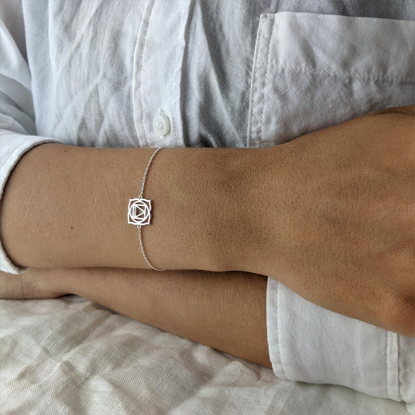 
                  
                    Sterling Silver Cut-Out Root Chakra Thin Cable Chain Bracelet
                  
                